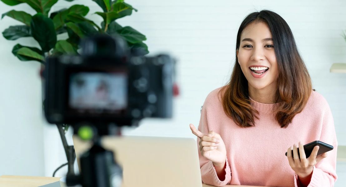 How to Make Money as a Content Creator. Woman in front of video camera.